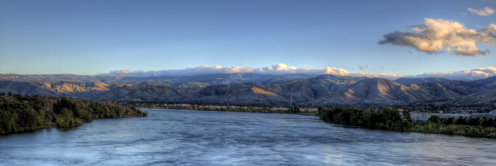 View of sky, clouds, mountains and river